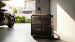 Bluetti portable power station in modern garage with electric vehicle
