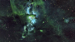 Deep space nebula with green and blue gas clouds surrounding bright stellar formation