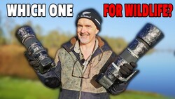 Wildlife photographer holding two telephoto lenses in outdoor setting with water and trees in background