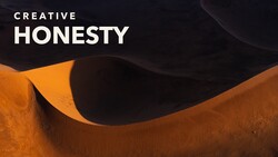 Abstract composition of curved orange and black surfaces with dramatic shadows and smooth contours