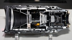 Disassembled camera body showing internal mechanical components and mirror mechanism