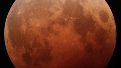 Blood moon during total lunar eclipse with deep red-orange coloration