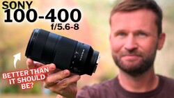 Man holding Sony 100-400mm f/5.6-8 lens with text overlay 'Better than it should be?'