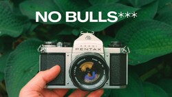 Pentax film camera held in hand with text overlay reading 'NO BULLS***'