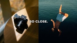 Split-screen comparison with compact camera on wooden surface and person diving into turquoise water with text overlay 'SO CLOSE'