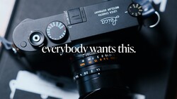 Top-down view of a Leica rangefinder camera with manual controls and aperture dial