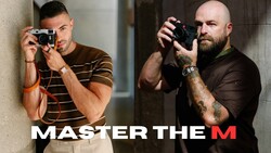 Two male photographers holding cameras in different shooting positions against concrete walls