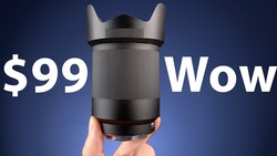 Hand holding cylindrical camera lens with price text overlay on blue background