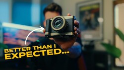 Photographer holding vintage film camera with expectation text overlay