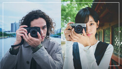 Two photographers holding rangefinder cameras, side-by-side comparison portrait