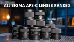 Collection of Sigma APS-C lenses arranged in a pyramid formation on a striped surface