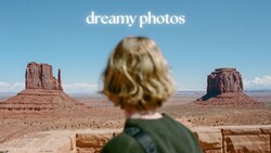 Person with blonde wavy hair viewing Monument Valley's iconic buttes from behind
