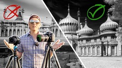 Man gesturing beside two tripod-mounted cameras, comparing a rejected monochrome palace shot with an approved one