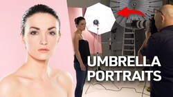 Portrait studio setup with umbrella softbox lighting and female model