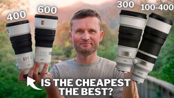 Photographer holding four telephoto lenses labeled with focal lengths 400, 600, 300, and 100-400