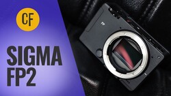 Video thumbnail for the Sigma FP2 camera, showing the black compact body with its exposed sensor on black leather, beside bold white text.
