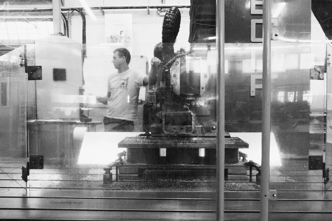 A machinist operates a CNC mill at CERN - Photo by Christine Woodard