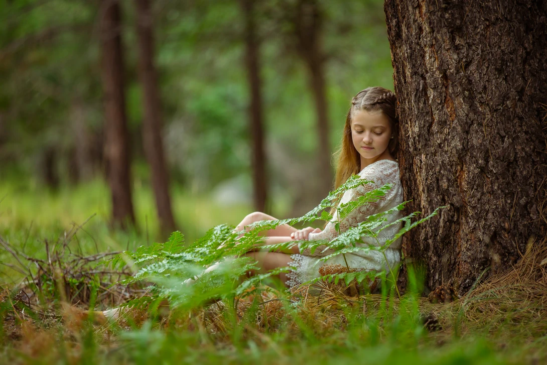 portrait of a girl taken from a prone position close to the ground