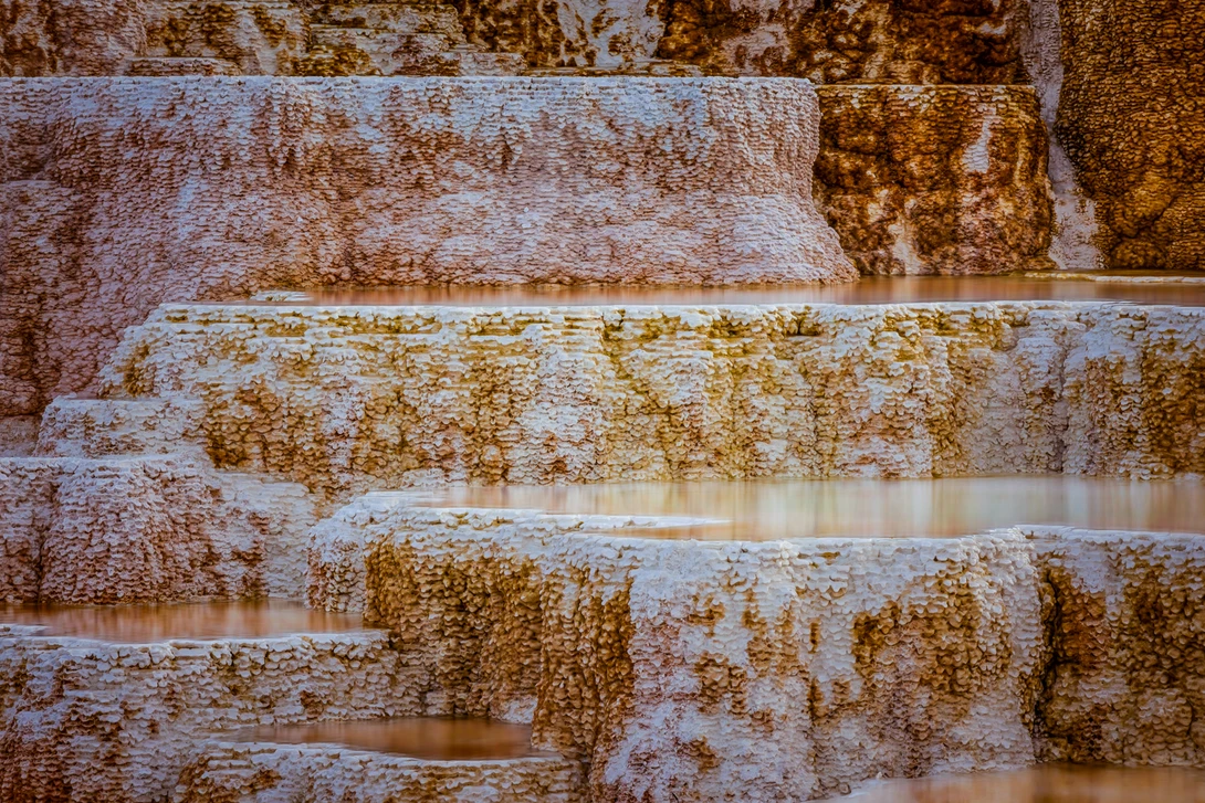 close up shot of water formations at mammoth hot springs