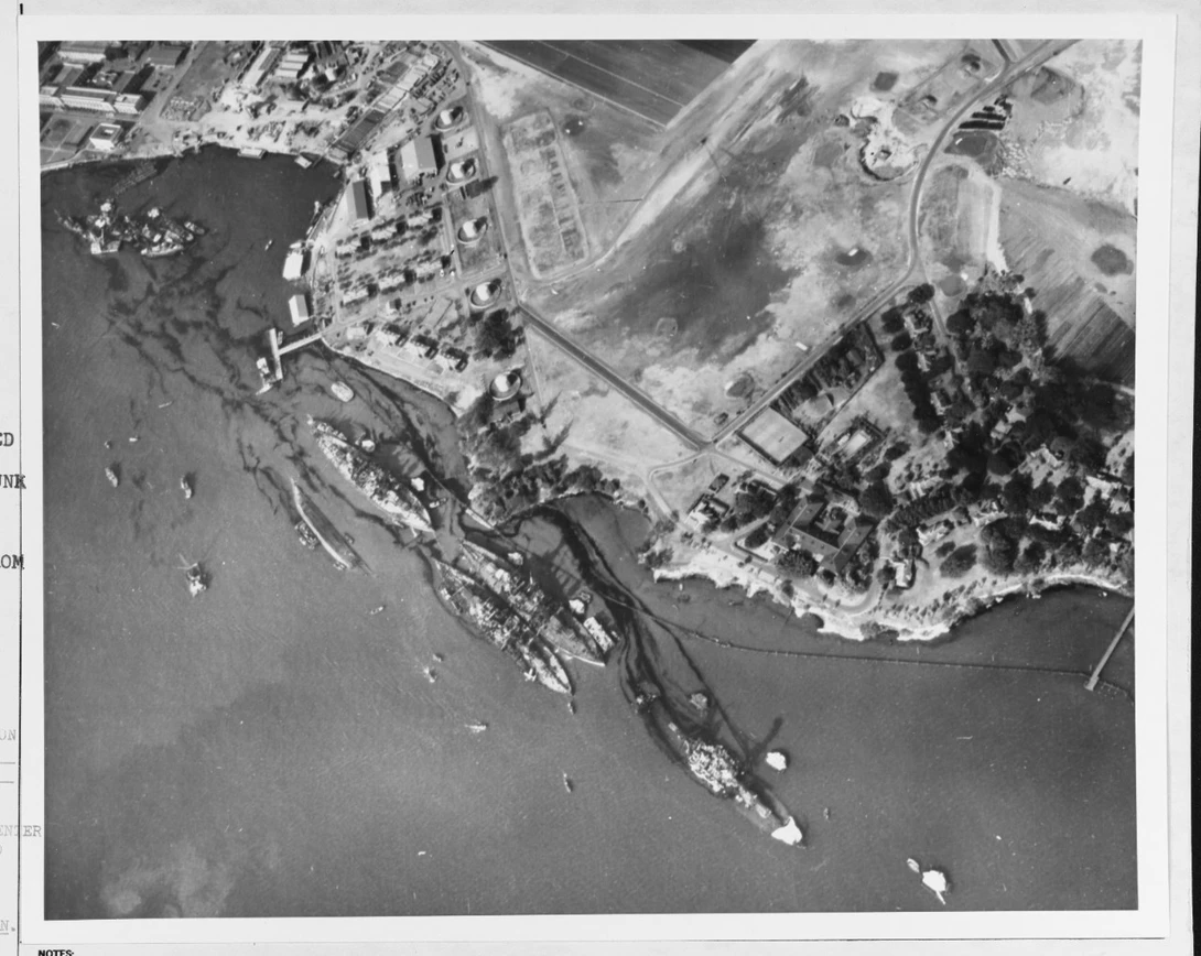 This, to me, almost looked like an old drone shot. "Aerial view of Battleship Row moorings on the southern side of Ford Island, 10 December 1941. ... Note dark oil streaks on the harbor surface, originating from the sunken battleships."