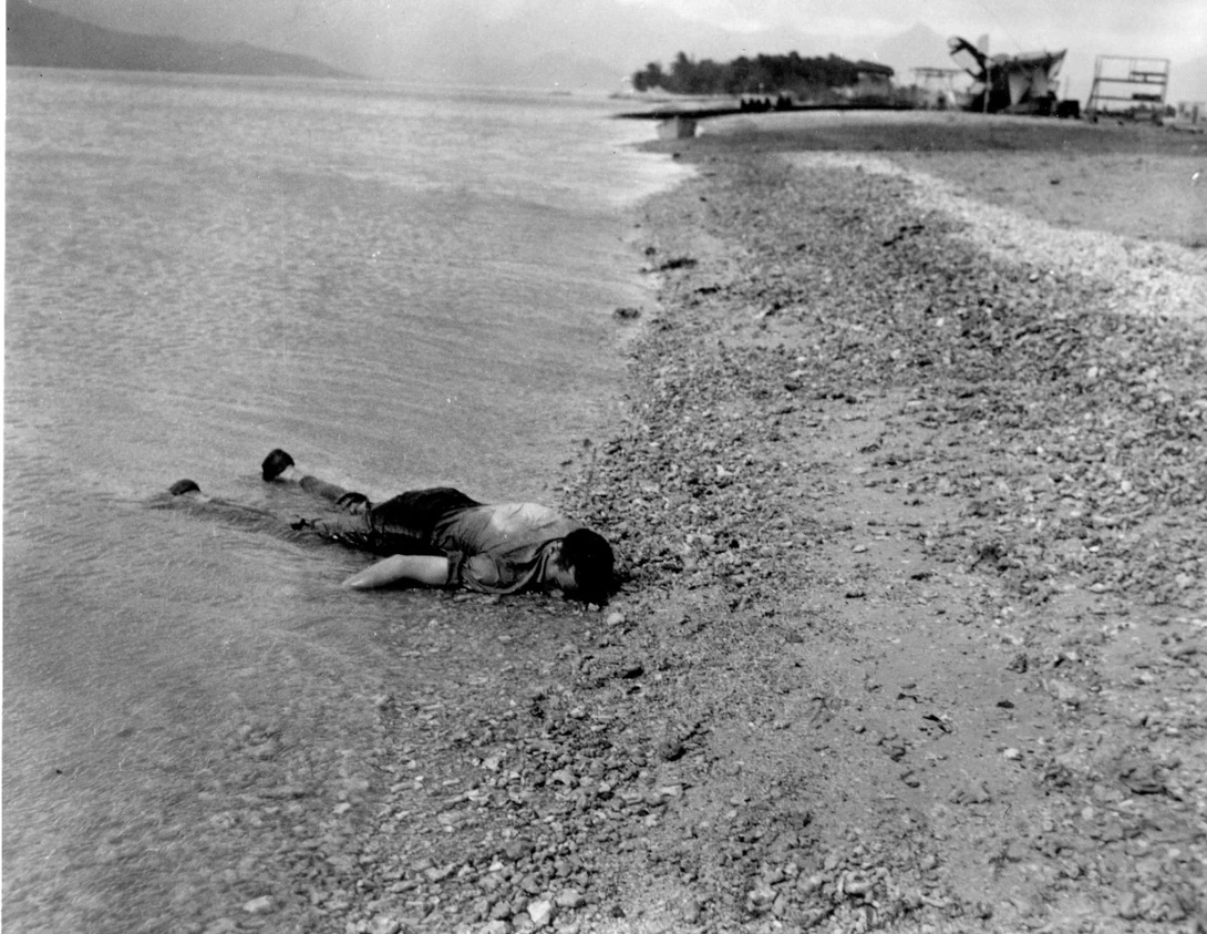 Sailor lies face down, killed during the air attack at the Naval Air Station in Kaneohe Bay. 