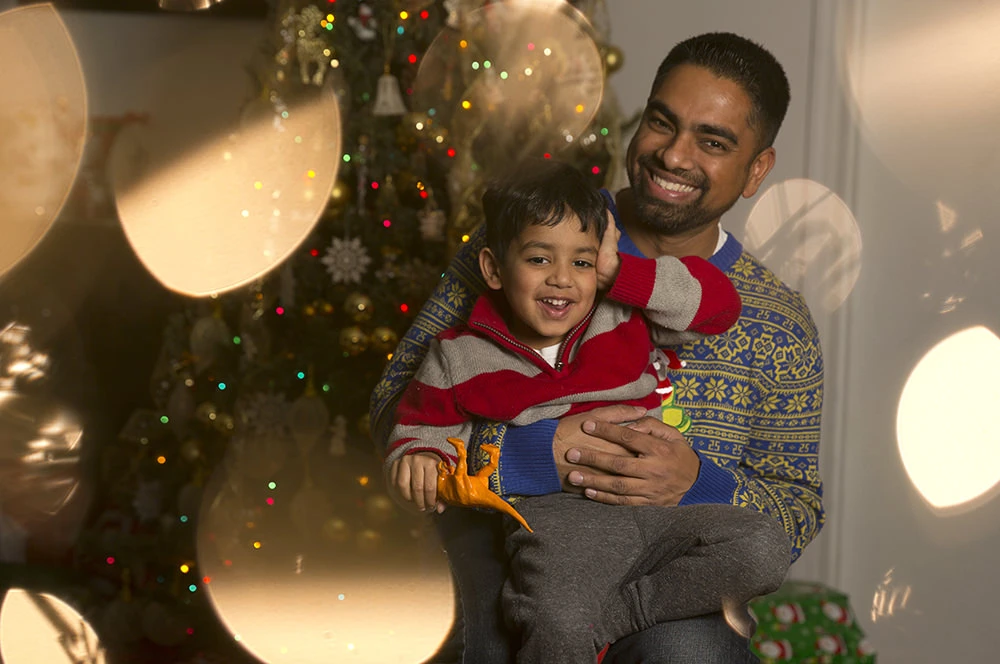 I used a tree with colored lights for the background, then loaded the image into a multiple exposure and used lights from another tree for the foreground.