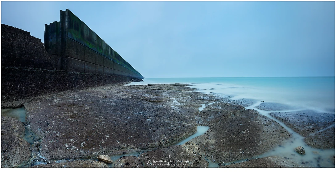 The remains of WW2 during low tide. A nice sunset would have been nice, but there is more than that. But it is difficult to see it when your expectations are too great. (EOS 5D mark IV + EF16-35mm @ 16mm | ISO100 | f/11 | 60sec | Kase CPL + ND1000 | 2 sho