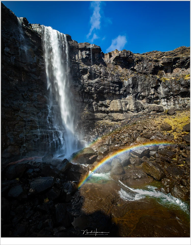 The largest waterfall of the Faroe Islands, called Fossá. I choose a location with the sun from behind to capture the spraybow (Canon EOS 5D4 with 16mm | ISO100 | f/9 | 1/25 | four horizontal images stitched)