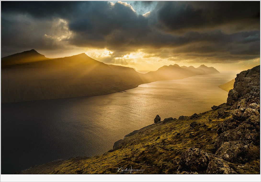 Amazing light at an amazing location. On top of mountain Klakkur at the Faroe Islands watching a great sunset. What would you give to shoot landscapes at such a location? (Canon EOS 5D4 + 23mm | ISO100 | f/8 | 1/640)