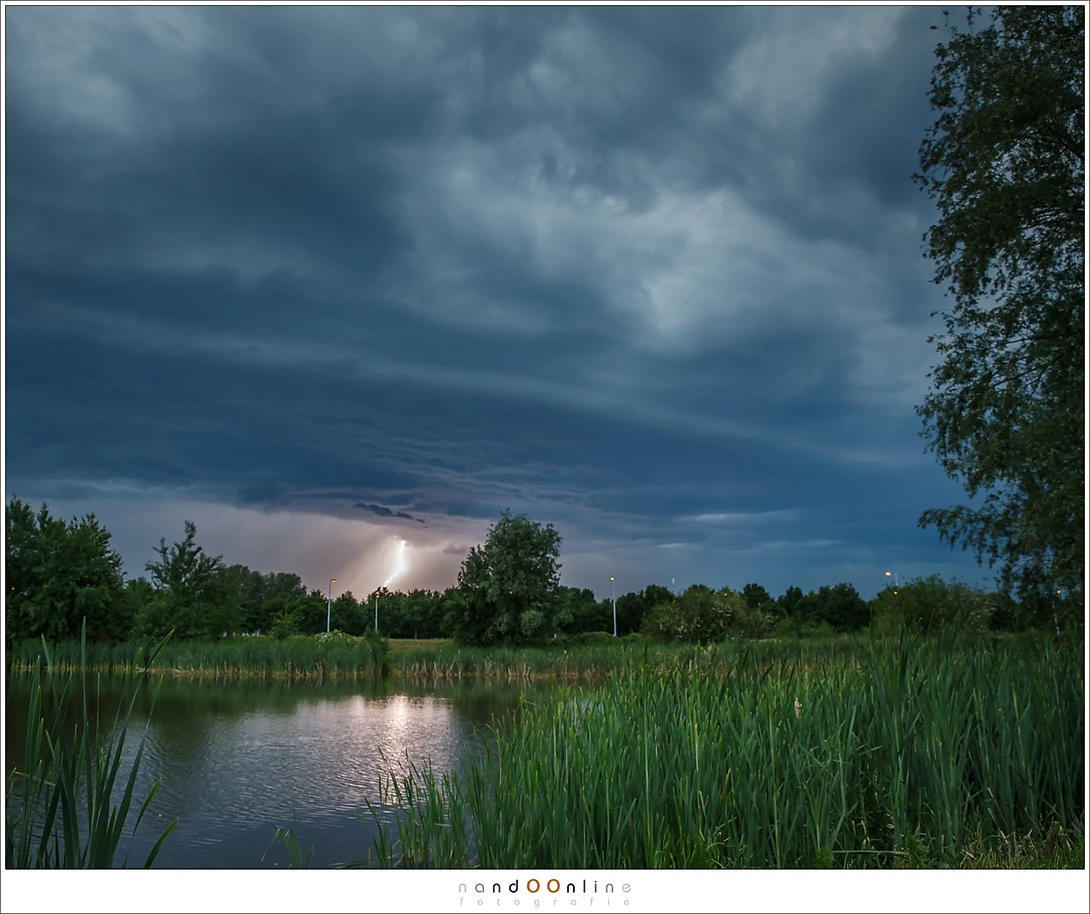 The same fishing pond, during a thunderstorm. Choosing the right position I was able to leave any traces of human signs out of the frame, except for the lampposts. (Canon EOS 1Dx + 24mm | ISO800 | f/5,6 | 1/60)