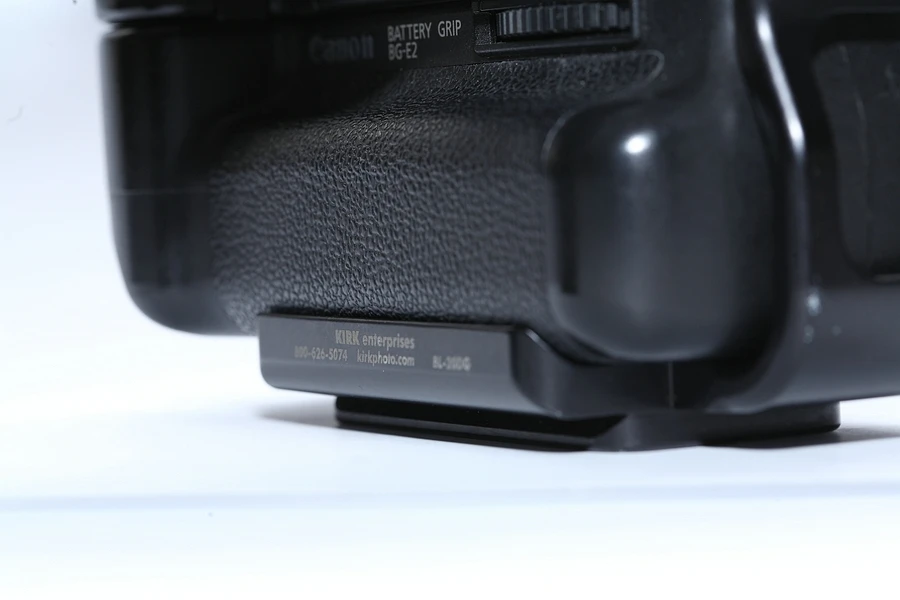 The L-bracket is designed for a specific camera model, like this Kirk Enterprises L-bracket for the Canon EOS 20D. There is no risk this plate will rotate when connected to the tripod.