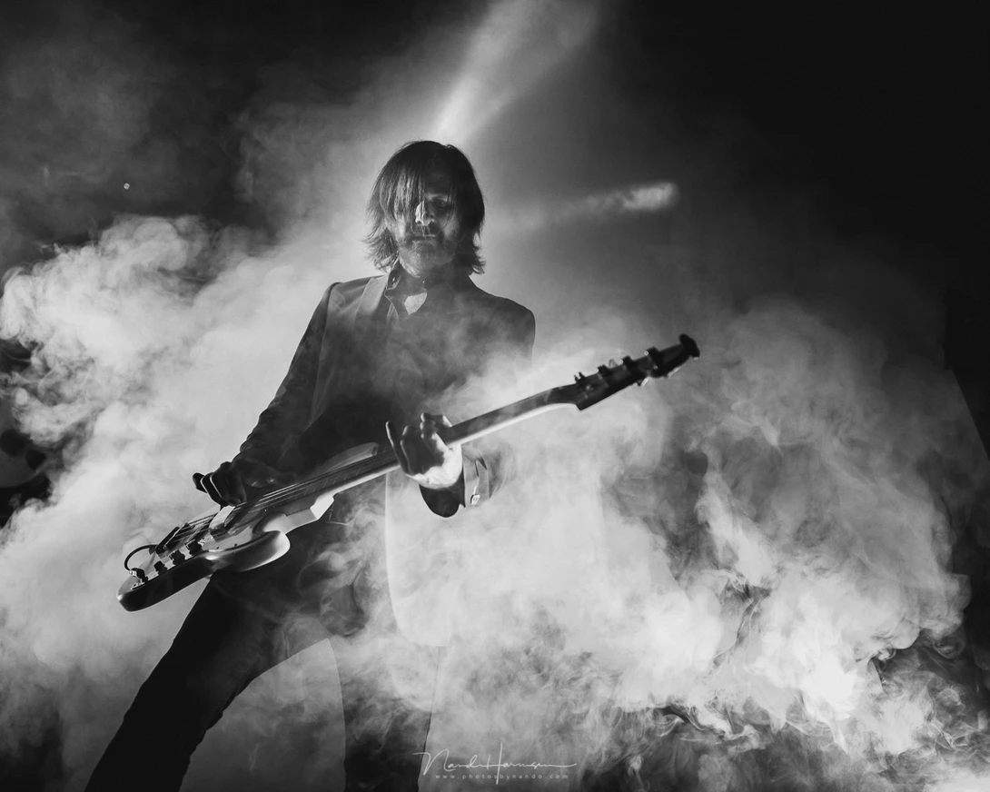In black and white there is no color distraction. This way it is easier to judge a photo on contrast and composition. This works for all sorts of photography of course. Here I photographed the Dutch band Palais Ideal during its recent concert performance 