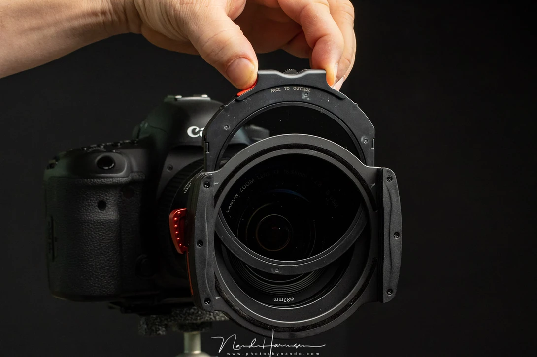 THe drop-in filters are kept in place by two small notches on the side. It is enough to prevent the drop-in filter from falling out. It works very well.