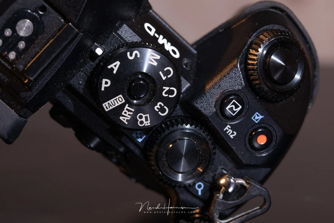 Part of the button layout of the Olympus OM-D E-M1 II. 