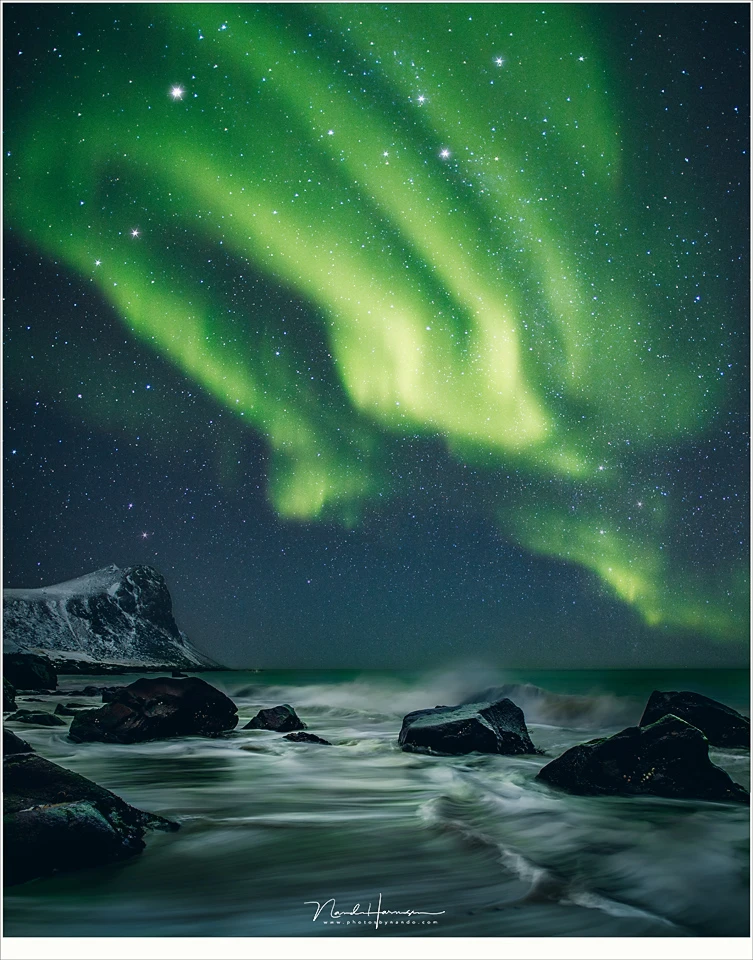 Reality or manipulation? It could be real, but it isn't. I merged a daylight photo of this beach at Lofoten, and added an aurora image I took that same photo trip. 