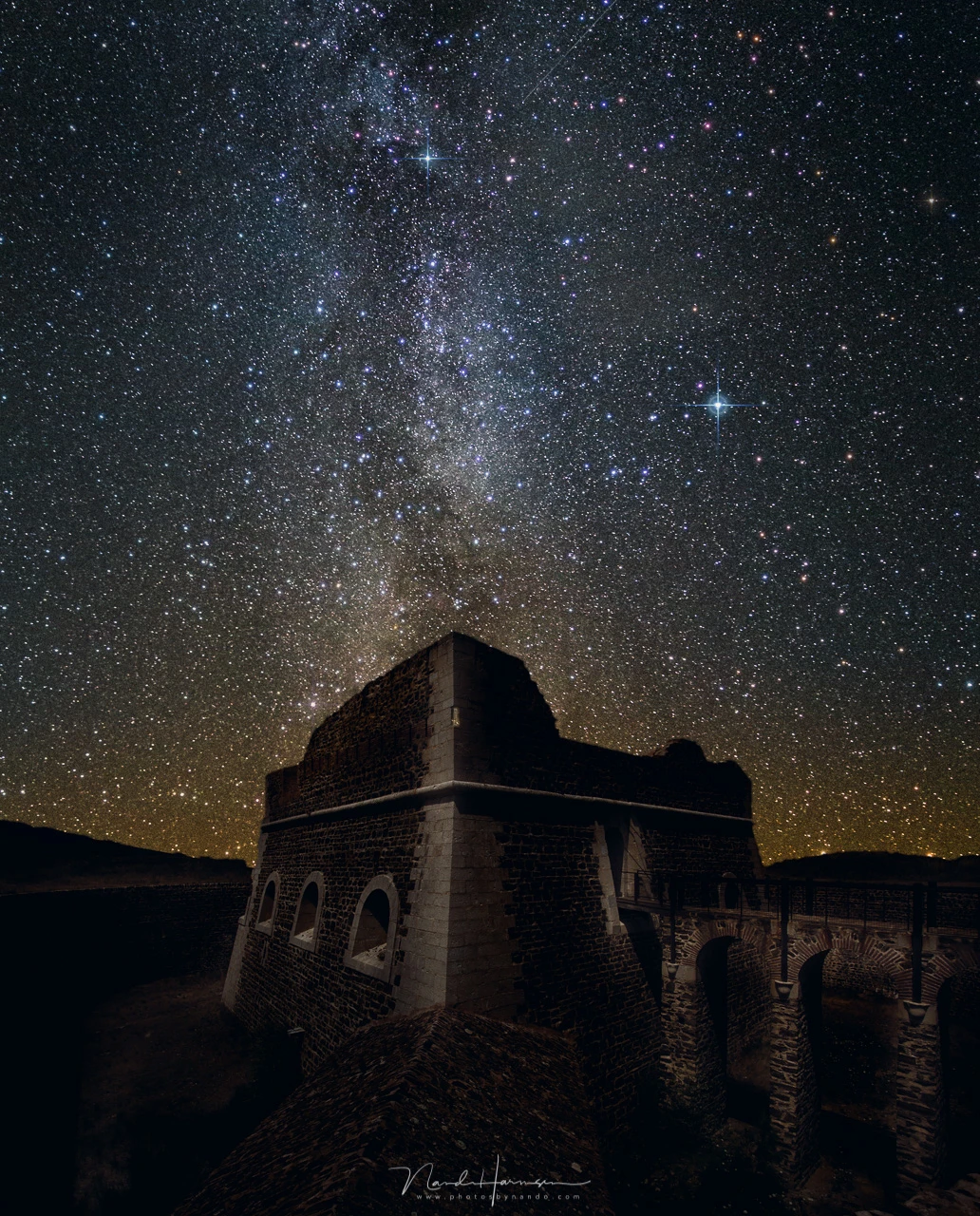 Reality or manipulation? I photographed this fortress during a summer holiday in broad daylight. I transformed it into a night scenery, and added a Milky Way photo I made somewhere else. As a matter of fact, the image is facing North, away from the cent