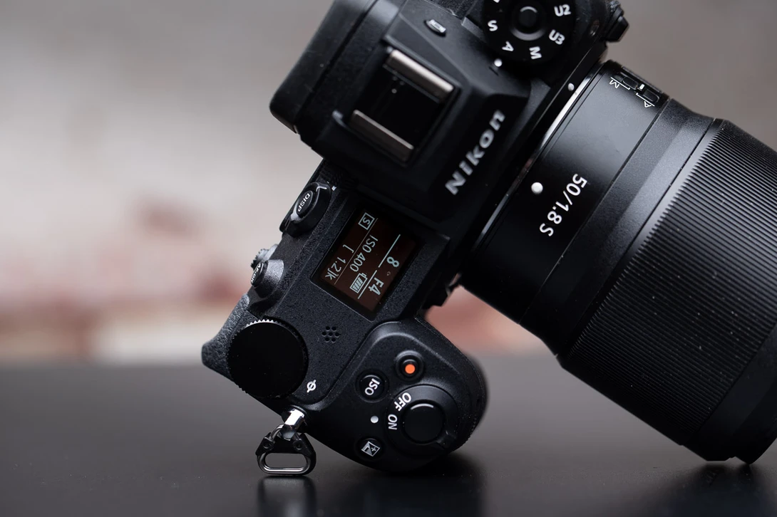 The Nikon Z6-2 with a prime lens. It is small and light weighted. Three primes can be easier to carry compared to one big zoom lens.
