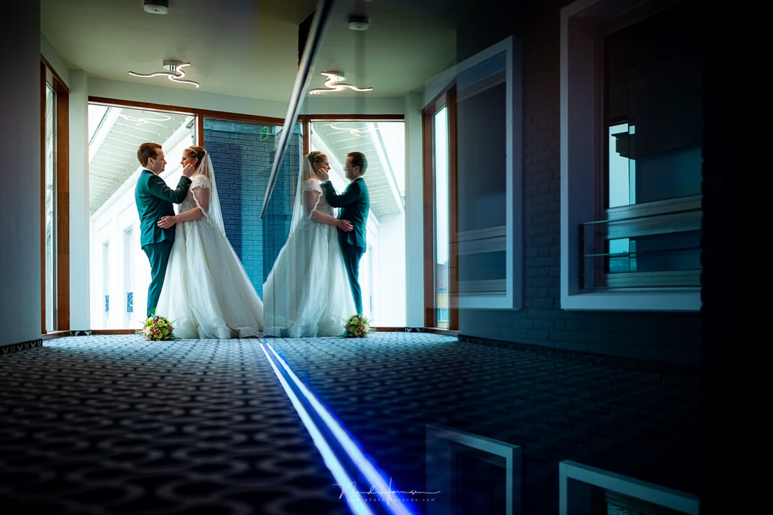 A glass balustrade was enough for this reflection. At the right side of the image the glass is transparant, in the middle of the image it's reflective. It all comes down to the viewing angle.