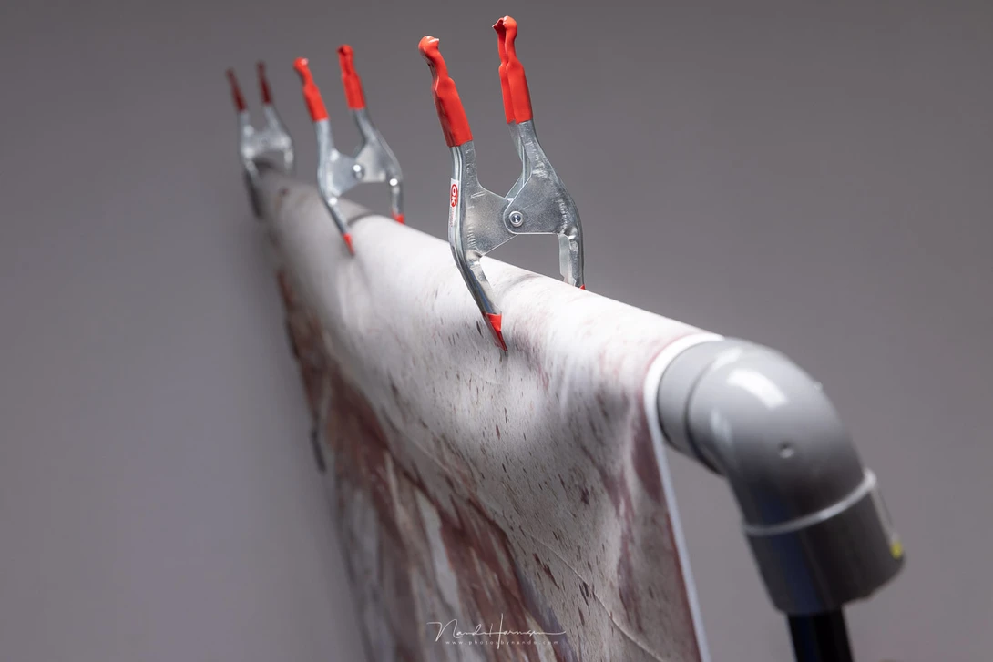A drain pipe, a couple of bends and you have your own self made background system.