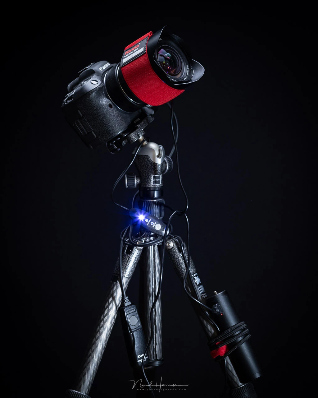 The setup with the powerbank tied to a tripod leg. The blue LED is very bright.&nbsp;