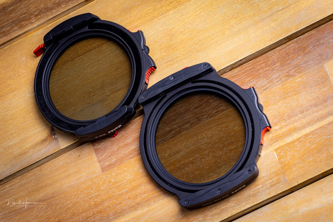 The first and second generation Haida M10 filter holder. The one at the top is the M10-II version. Look at the slimmer design, and the wider light leak foam ring.