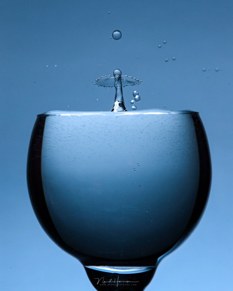 Using a glass for water droplets can be nice. The lighting needs to be perfect, just like the timing when you want droplets to collide.