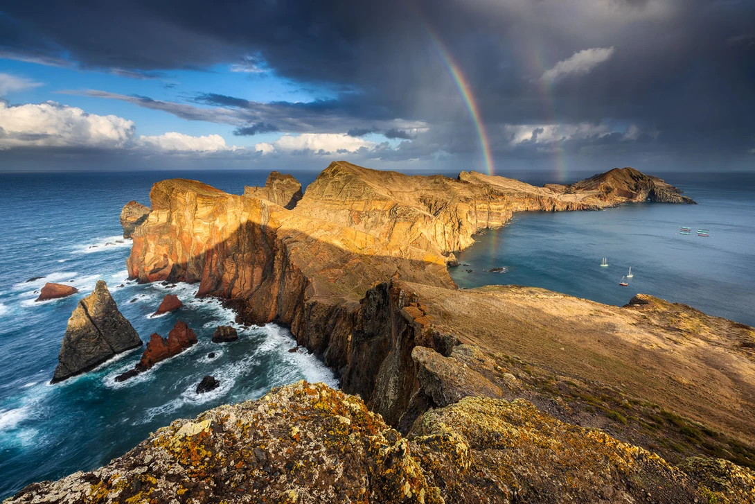 Cliffs at Ponta de Sao Lourenco with Rainbow and warm Light