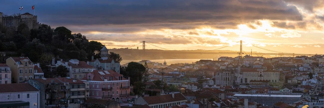 Dramatic Clouds and Light Over Ponte 25 de Abril Bridge