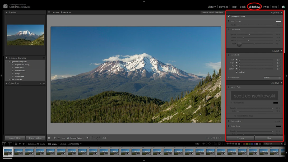 Snow-capped stratovolcano with forested slopes under clear blue sky, displayed in photo editing software.