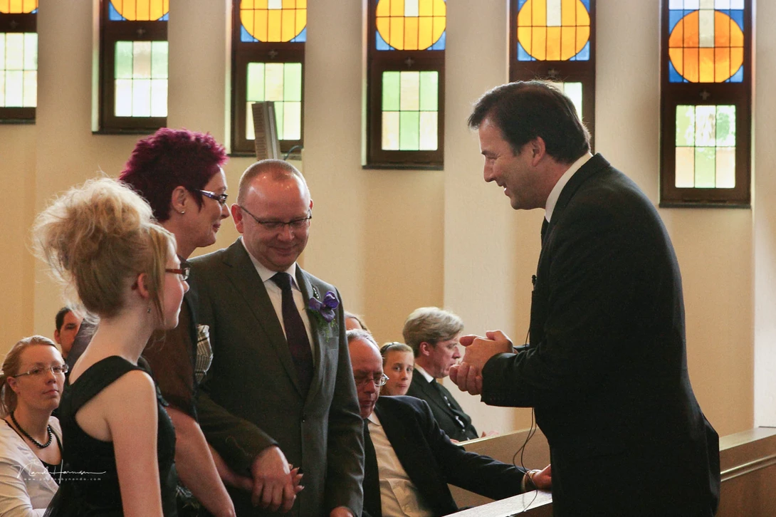 By only using ambient light you can end up with terrible light and shadows in your image. This wedding photo is a good example.