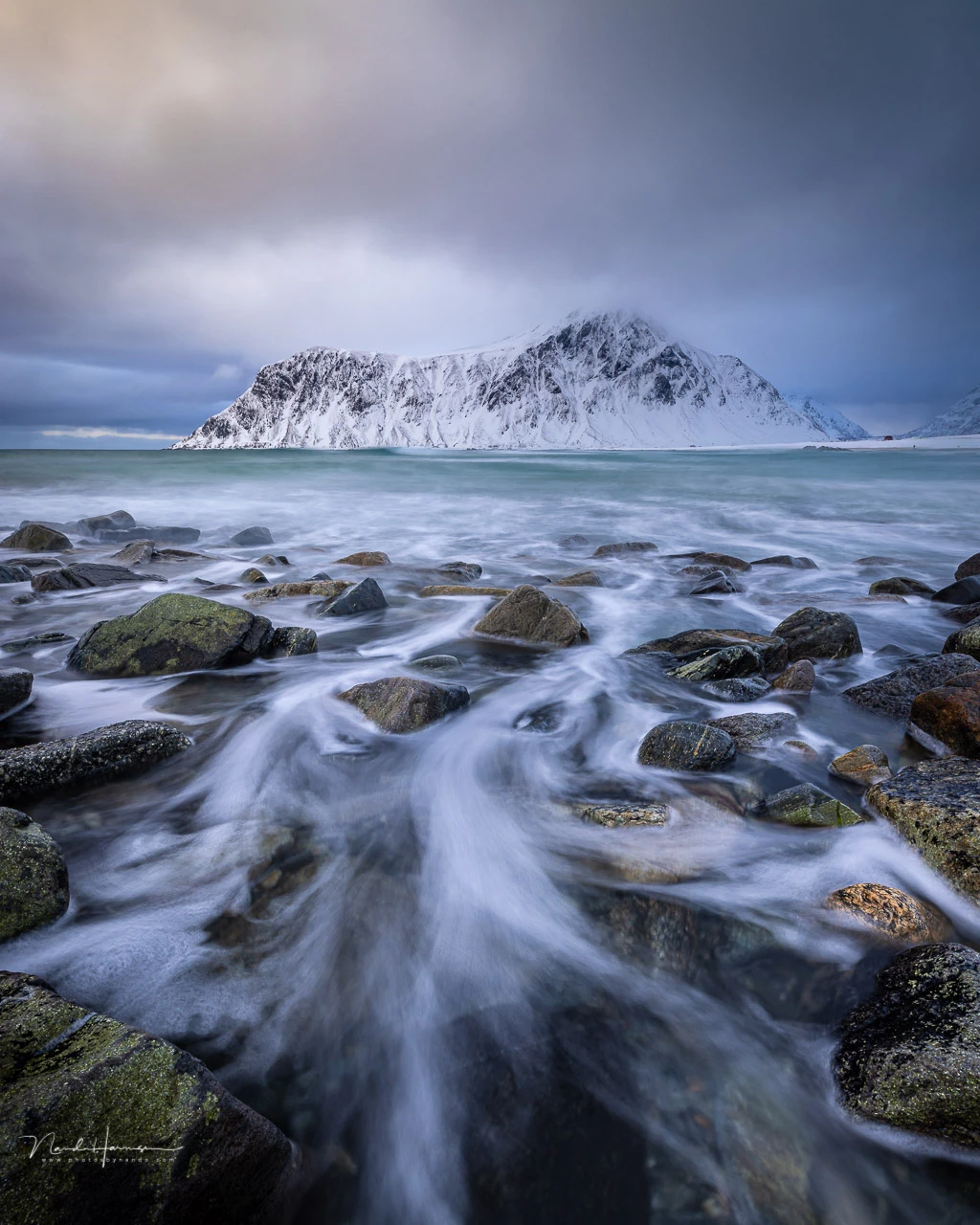 The surf at Skagsanden beach. It was raining during this photo. The behind the scenes photo can also be found in this article.