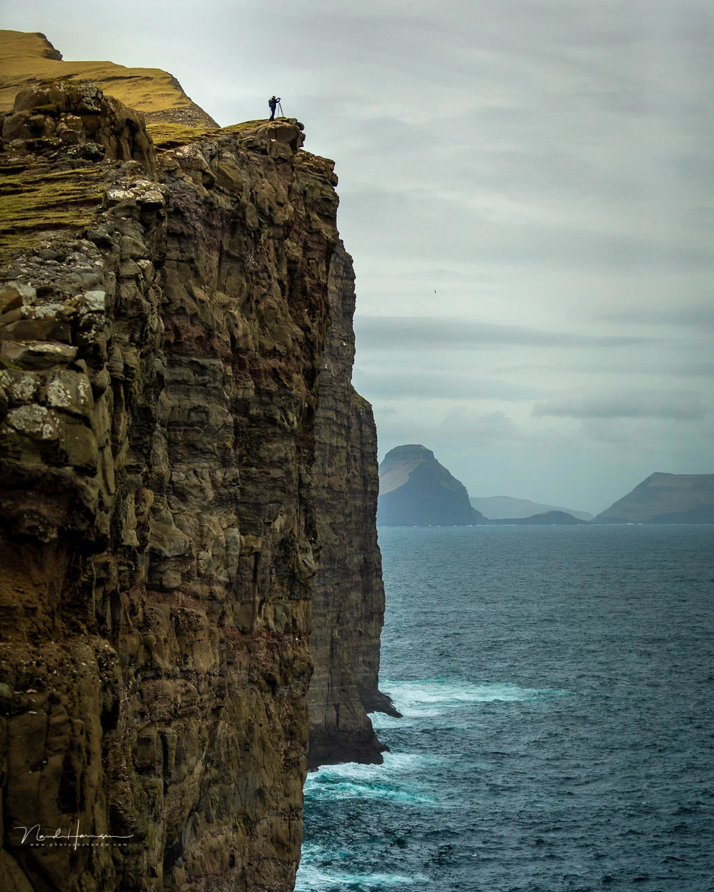 You wouldn't have know how tall these cliffs are, if it wasn't for the photographer on the edge. Adding this photographer gives a sense of the size of the cliff.