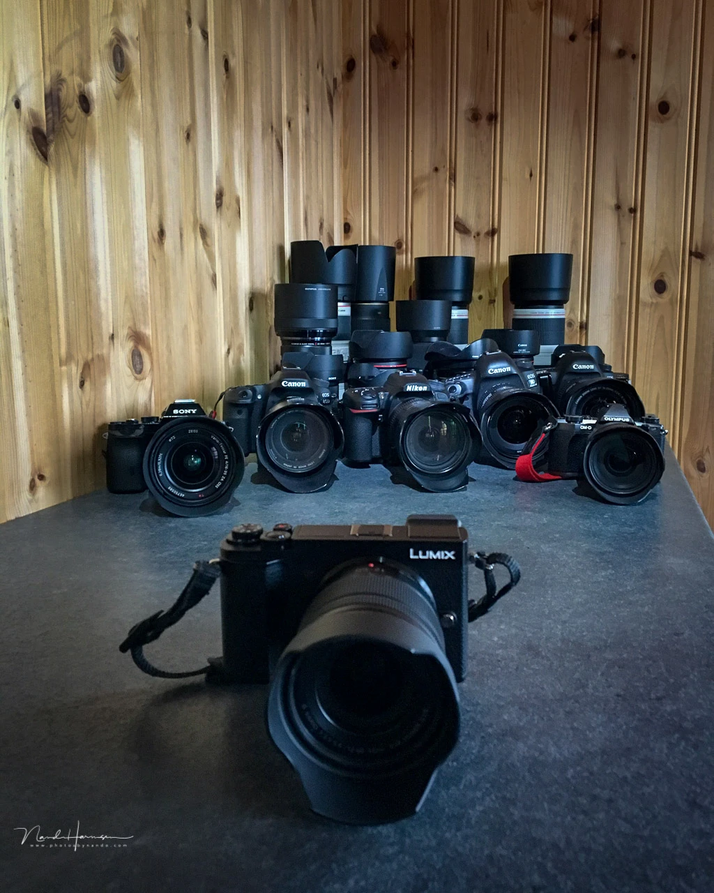 A couple of years ago I took this Panasonic Lumix M43 camera to Lofoten for a review. In the back you see the equipment of the photographers I took with me on this trip.