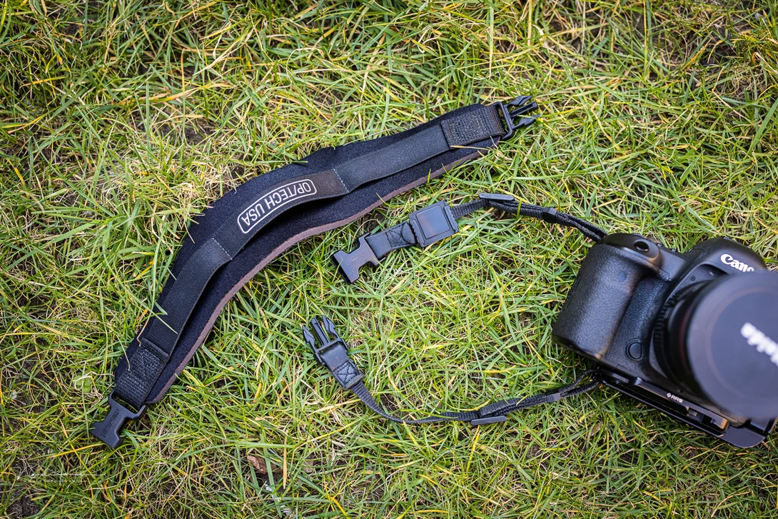 The Op-Tech strap comes in parts. I removed the strap itself and used the connectors on the camera as a hand strap.